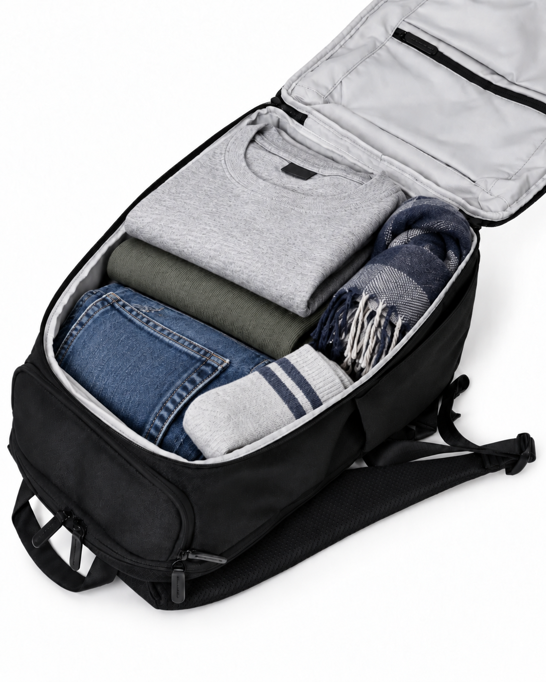 The Kuro Switchpack unzipped flat and neatly packed with folded clothes